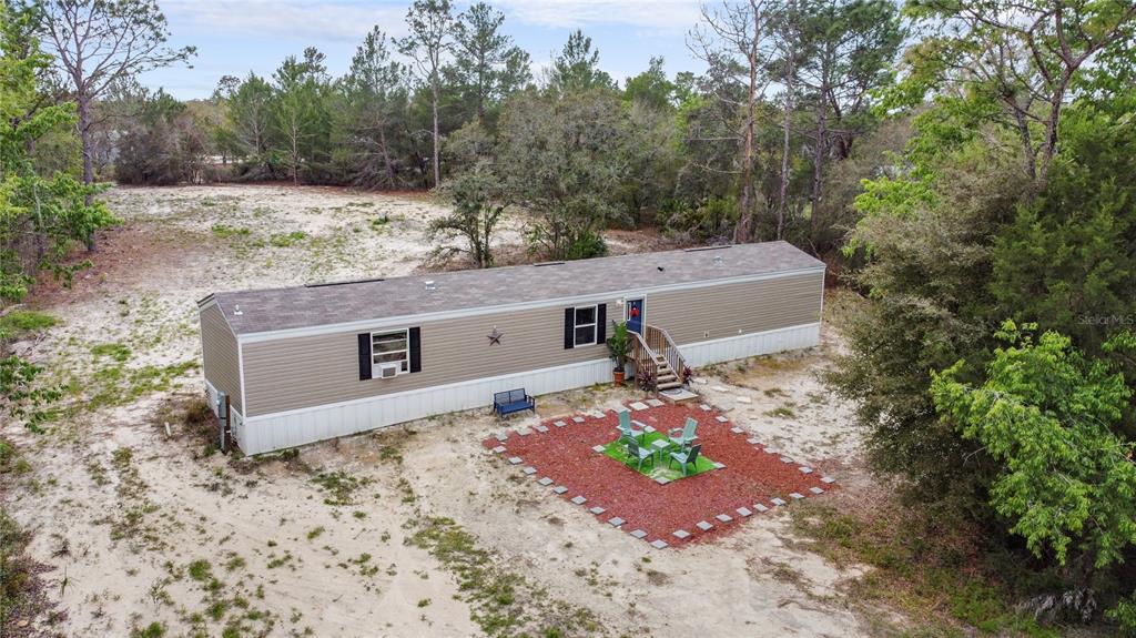 16770 Southwest 60th Place Ocala, FL 34481 - Photo 2 of 26 an aerial view of a house with yard and garage