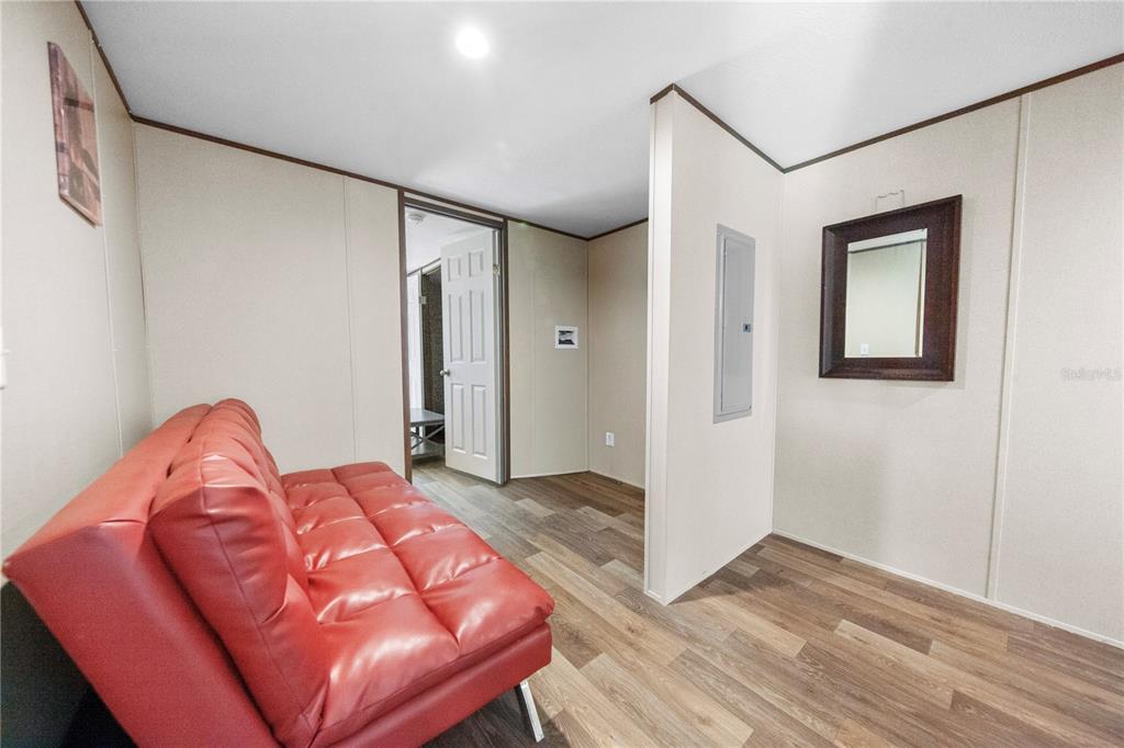 16770 Southwest 60th Place Ocala, FL 34481 - Photo 23 of 26 a bed room with a bed and a chair