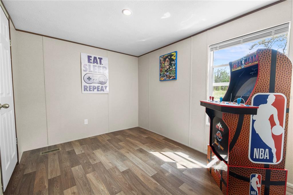 16770 Southwest 60th Place Ocala, FL 34481 - Photo 24 of 26 a view of an entryway with wooden floor