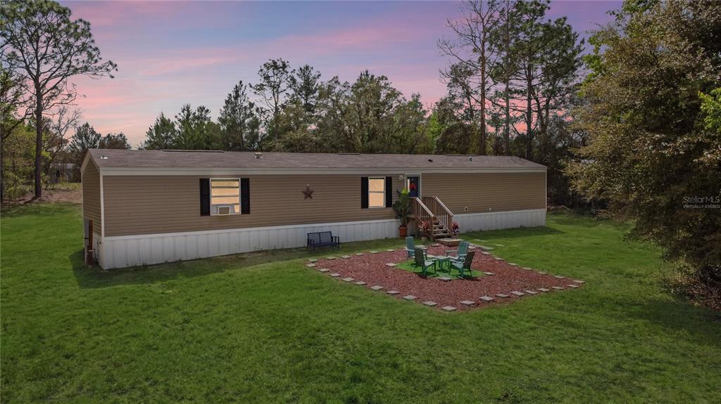 16770 Southwest 60th Place Ocala, FL 34481 - Photo 3 of 26 a view of a backyard with a garden