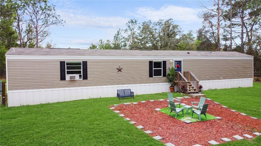16770 Southwest 60th Place Ocala, FL 34481 - Photo 6 of 26 a view of a house with a backyard