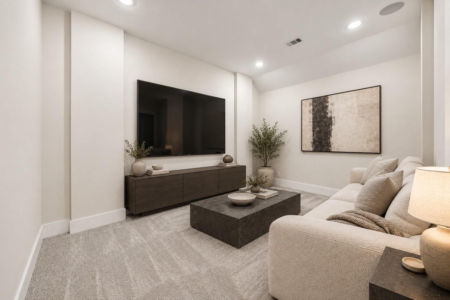 8558 Ridgepoint Drive Houston, TX 77055 - Photo 4 of 39 Deep seating, sculptural tables, and a quiet palette envision an inviting setting for movie nights and relaxed evenings. Virtually staged.