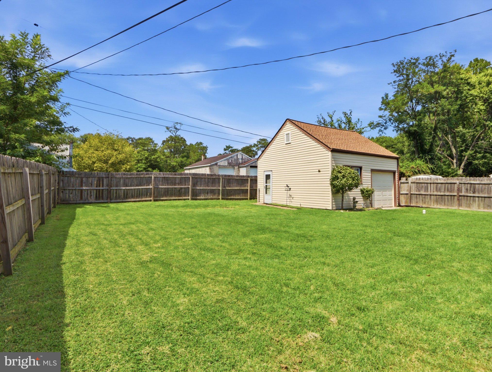 8176 Lea Road Pasadena, MD 21122 - Photo 19 of 23 Spacious backyard with charming shed.