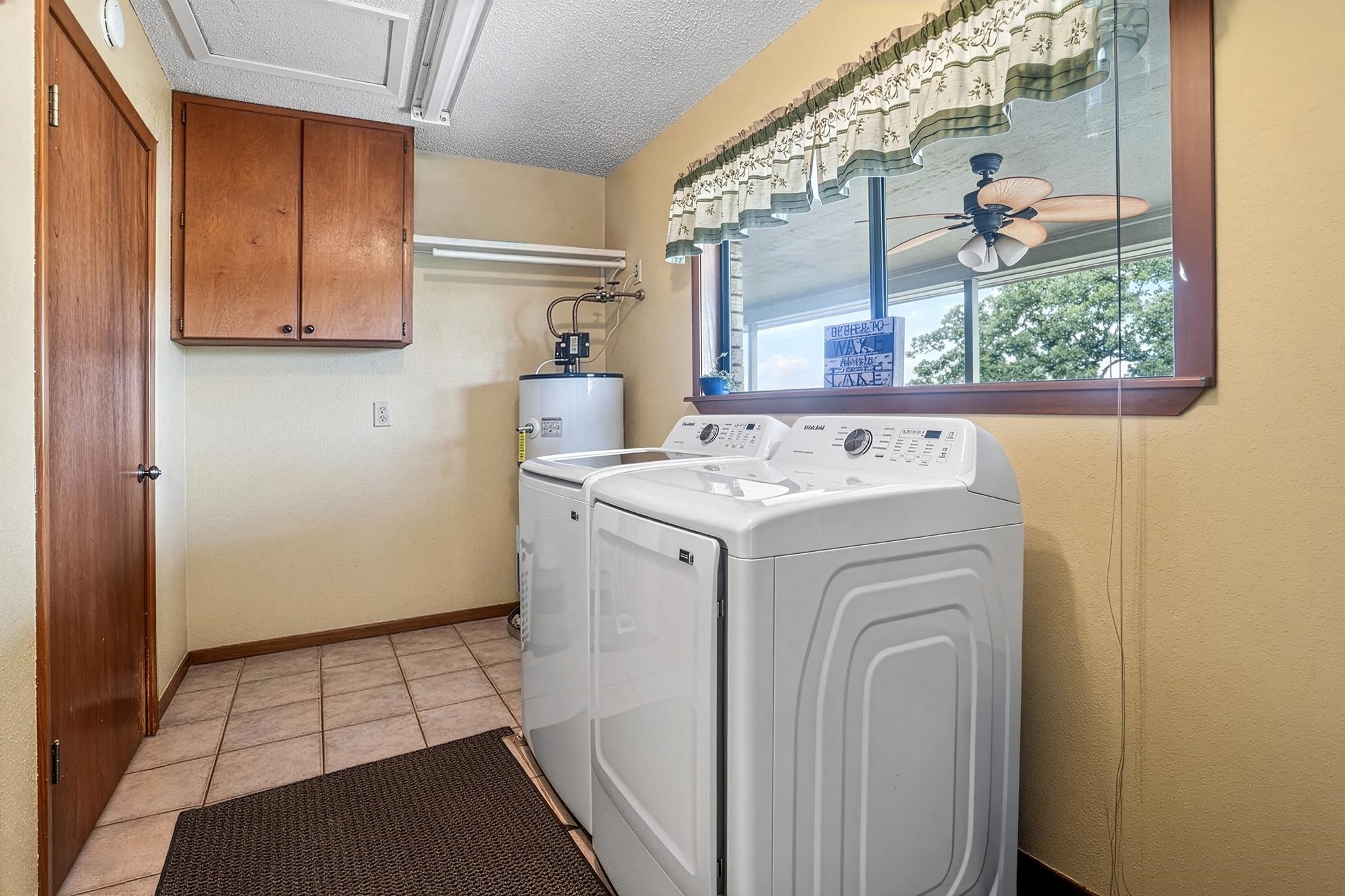 10465 Ranch To Market 1431 Buchanan Dam, TX 78609 - Photo 14 of 29 a utility room with dryer and washer
