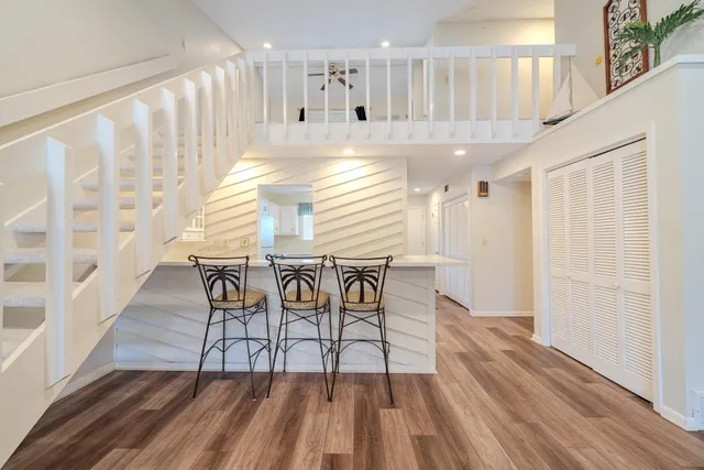 a view of entryway with wooden floor