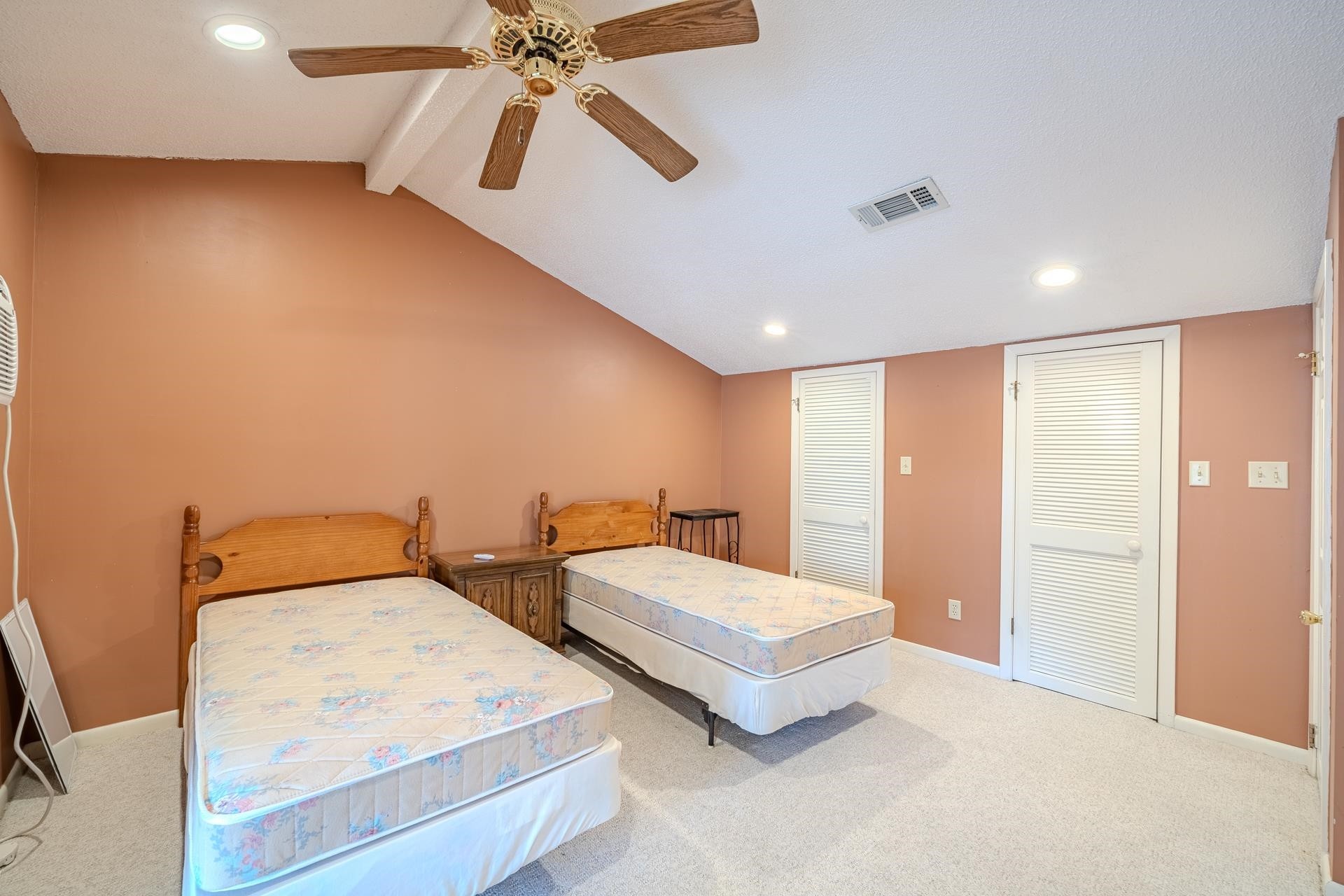116 Driftwood Road Counce, TN 38326 - Photo 20 of 31 a spacious bedroom with two beds and a chandelier