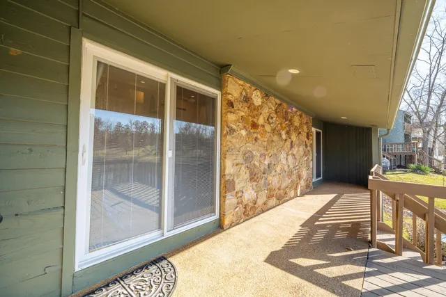 a view of a house with wooden fence