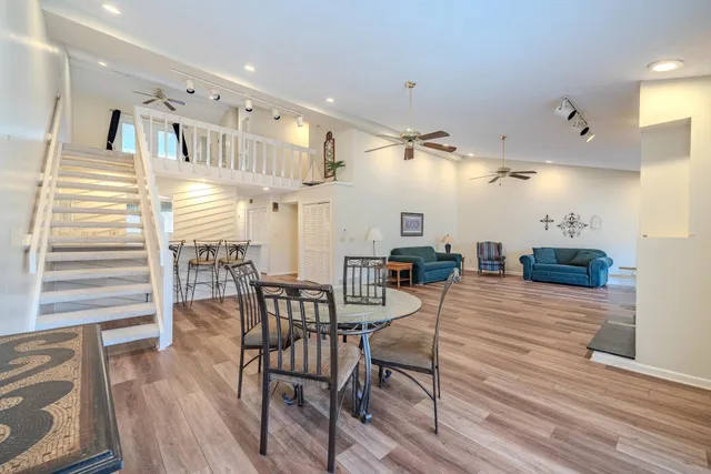 a view of a dining area with furniture and wooden floor