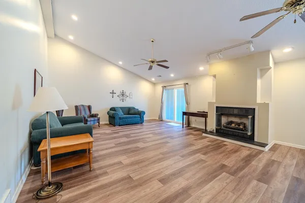 a living room with furniture and a fireplace