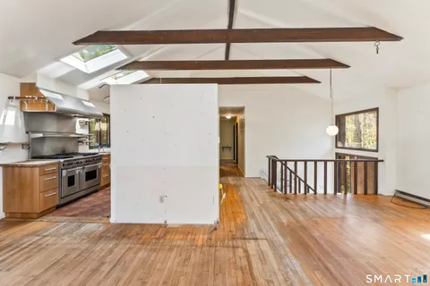 a view of a kitchen from the hallway