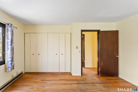 a view of a livingroom with wooden floor