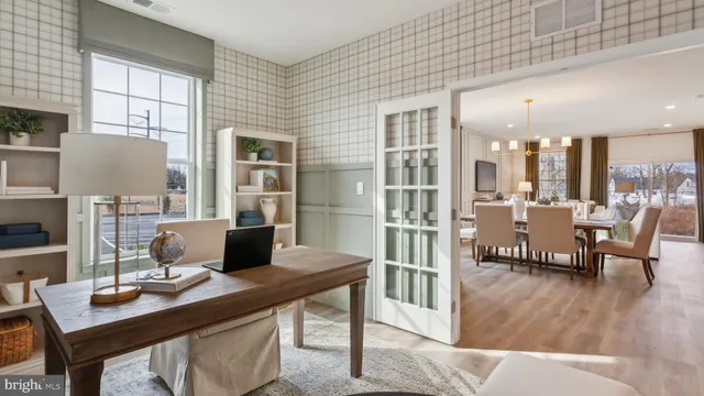 a workspace with furniture and window