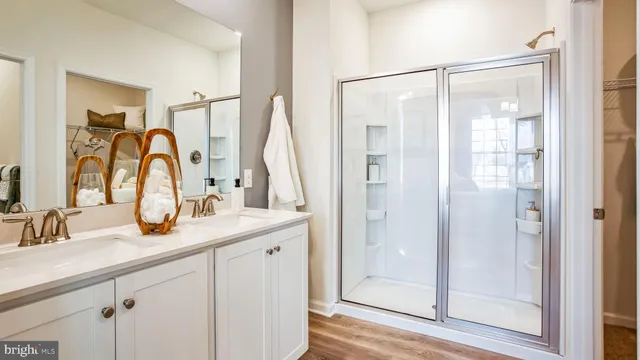 a bathroom with a double vanity sink and a mirror