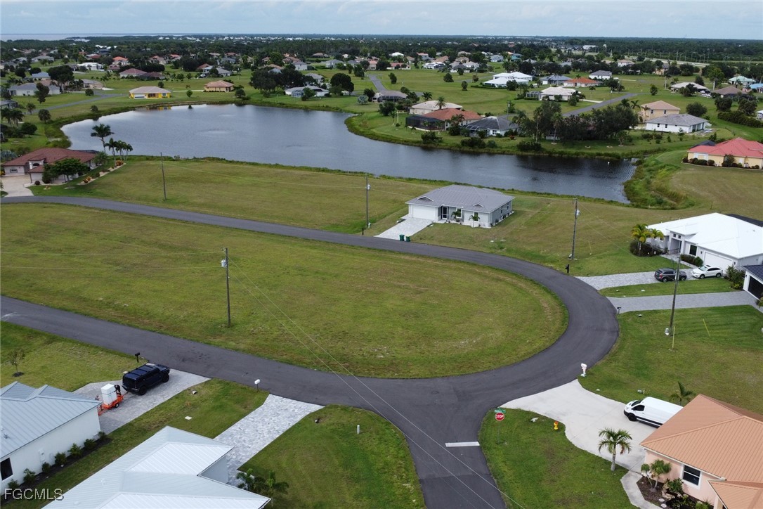 an aerial view of a house with a lake view