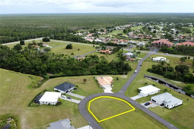 an aerial view of a house with a swimming pool yard and outdoor seating