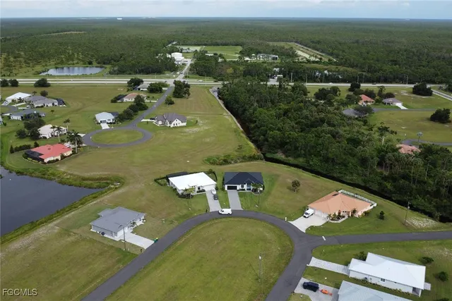 an aerial view of a house with a lake view