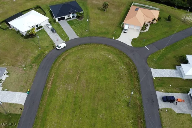 an aerial view of a house with swimming pool outdoor seating and entertaining space