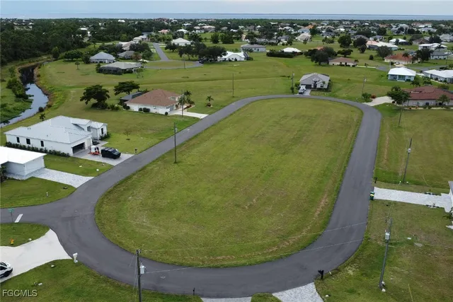 an aerial view of a house with outdoor space