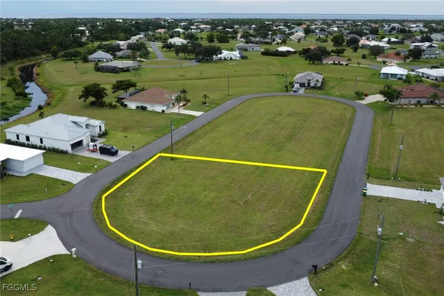 an aerial view of a house with a swimming pool
