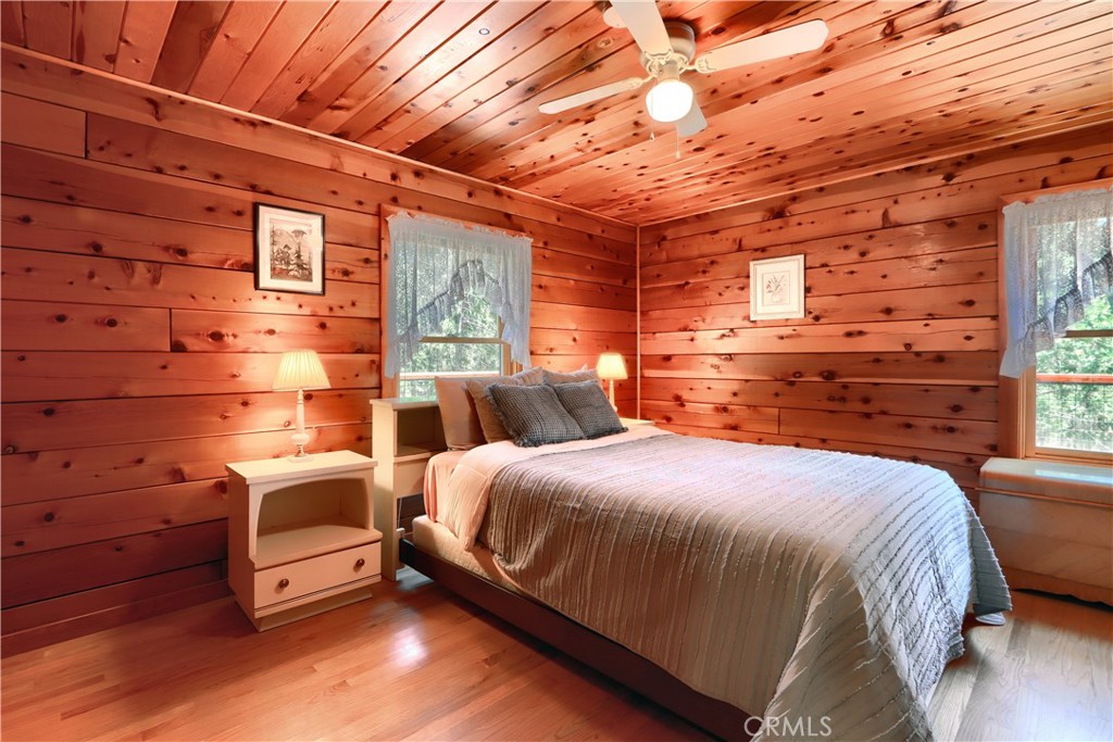 7190 Hites Cove Road Mariposa, CA 95338 - Photo 16 of 61 a spacious bedroom with a bed and a dresser