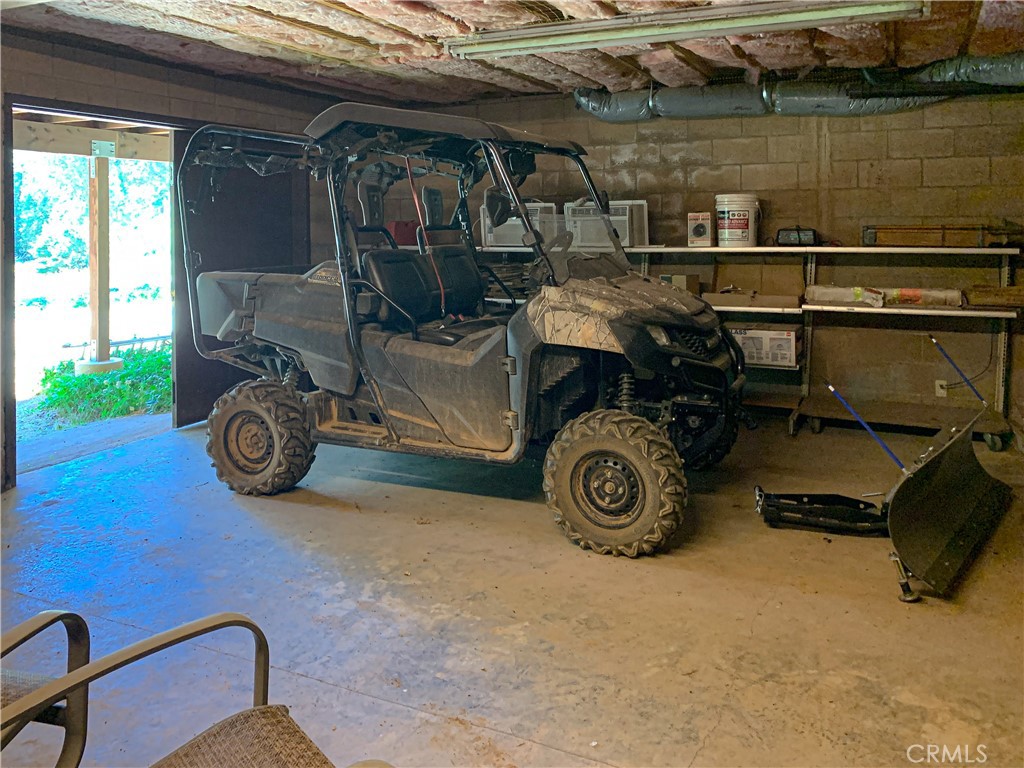 7190 Hites Cove Road Mariposa, CA 95338 - Photo 40 of 61 a blue bed sitting in a room next to a window