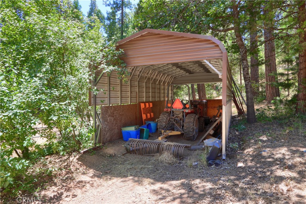 7190 Hites Cove Road Mariposa, CA 95338 - Photo 50 of 61 a view of a wooden house with a yard and sitting area