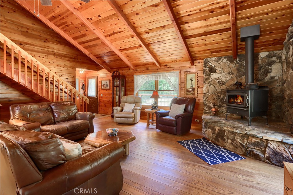 7190 Hites Cove Road Mariposa, CA 95338 - Photo 7 of 61 a living room with furniture and a fireplace