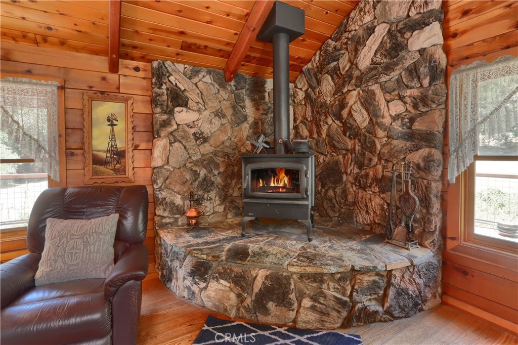 7190 Hites Cove Road Mariposa, CA 95338 - Photo 8 of 61 a living room with furniture and a fireplace