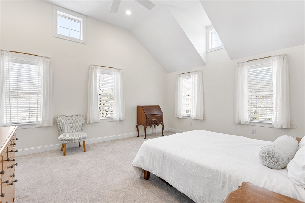 3 Fieldstone Circle, Unit 3 Wareham, MA 02576 - Photo 14 of 25 a bedroom with a bed and large windows