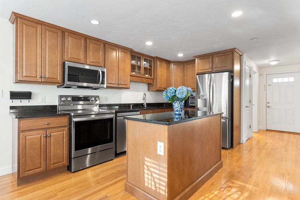 3 Fieldstone Circle, Unit 3 Wareham, MA 02576 - Photo 3 of 25 a kitchen with stainless steel appliances granite countertop a refrigerator stove microwave and sink