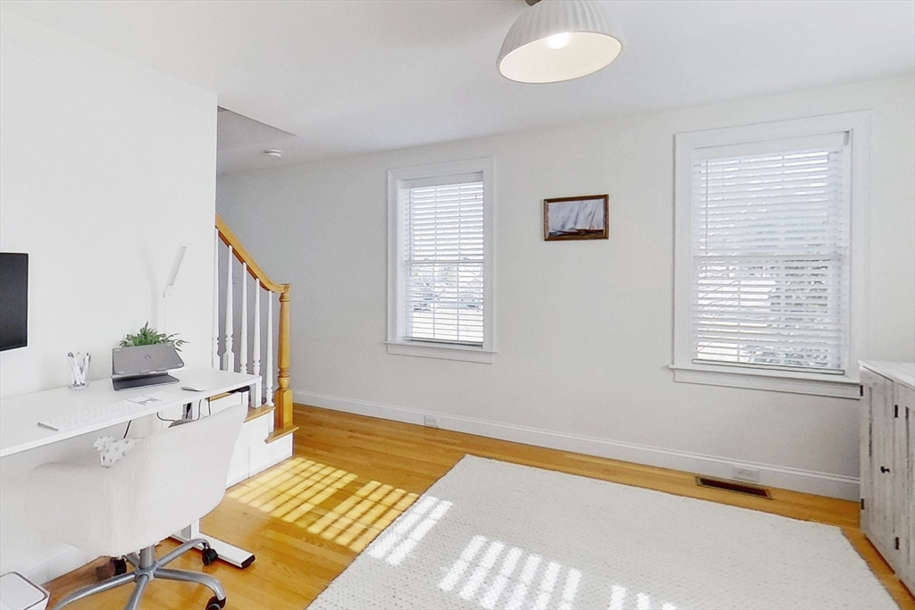 3 Fieldstone Circle, Unit 3 Wareham, MA 02576 - Photo 9 of 25 a spacious bedroom with a bed and a table in it