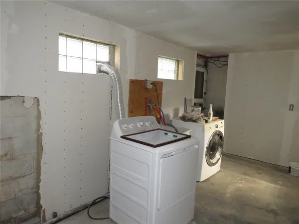 a utility room with washer and dryer