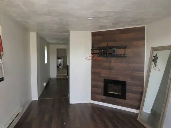 a view of a hallway with a fireplace
