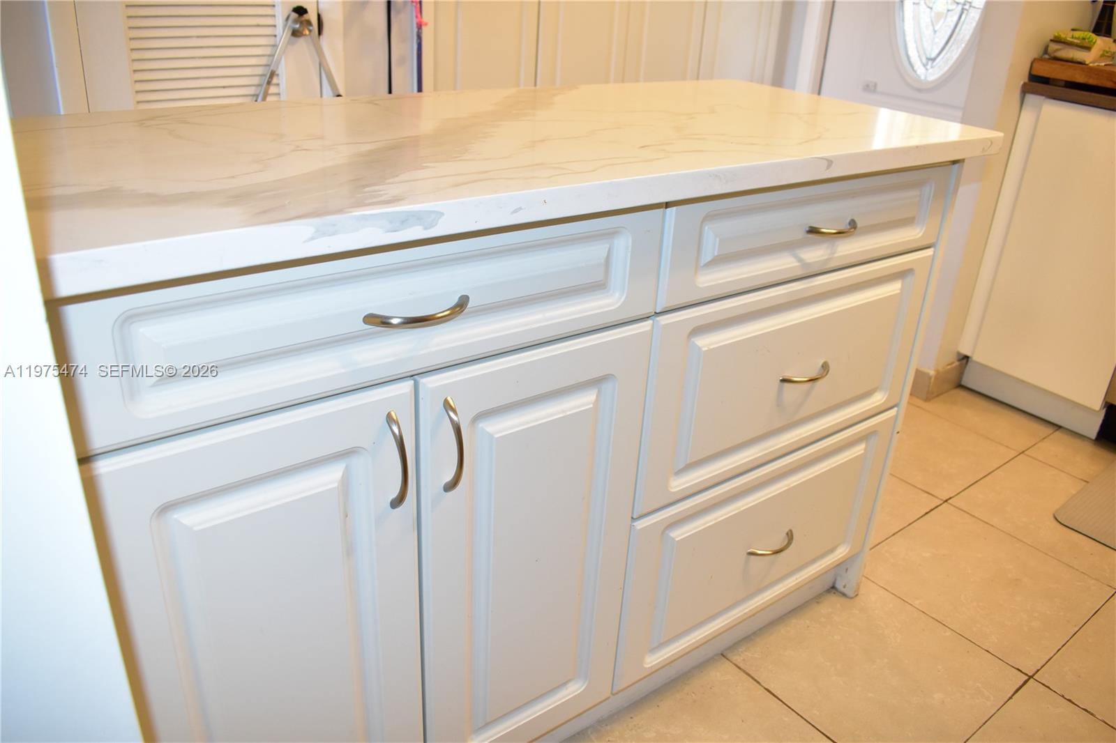 2801 North Pine Island Road, Unit 112 Sunrise, FL 33322 - Photo 13 of 49 a close view of a sink and a stove in the kitchen