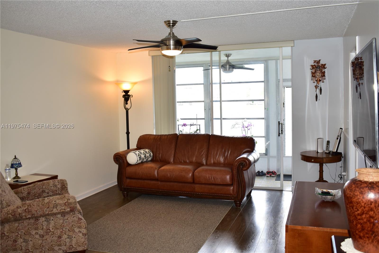 2801 North Pine Island Road, Unit 112 Sunrise, FL 33322 - Photo 15 of 49 a living room with furniture and a window