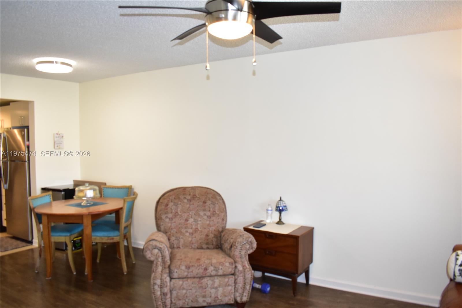2801 North Pine Island Road, Unit 112 Sunrise, FL 33322 - Photo 17 of 49 a workspace with furniture and wooden floor