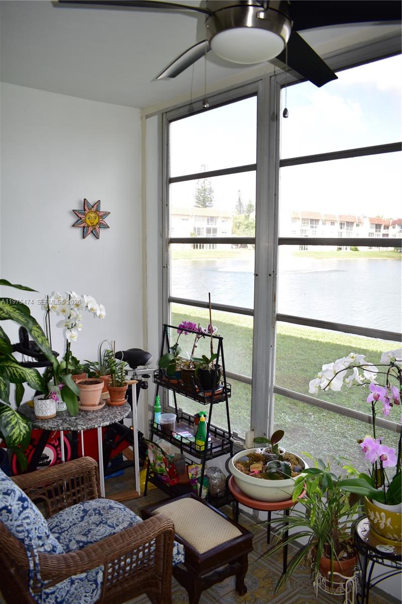 2801 North Pine Island Road, Unit 112 Sunrise, FL 33322 - Photo 20 of 49 a living room with furniture and flowers
