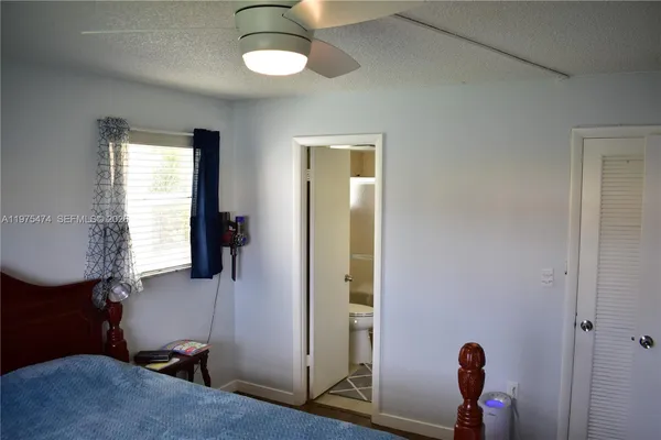 a room that has a bed and a window