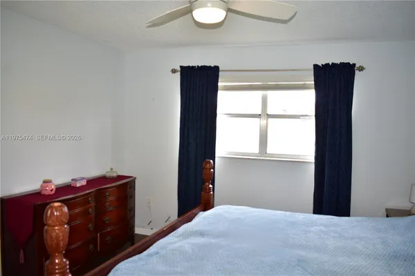 a bed room with a bed and a window