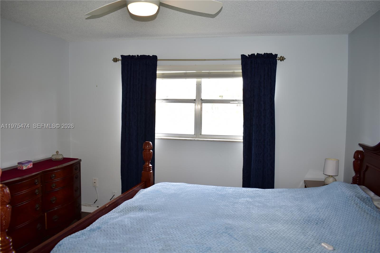 2801 North Pine Island Road, Unit 112 Sunrise, FL 33322 - Photo 24 of 49 a bedroom with a bed and a window