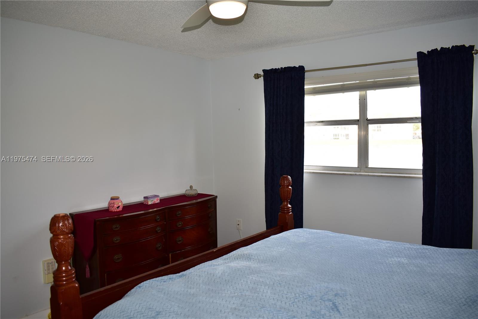 2801 North Pine Island Road, Unit 112 Sunrise, FL 33322 - Photo 25 of 49 a room with a dresser and a window