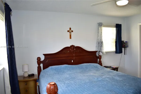 a bedroom with a bed and cabinets