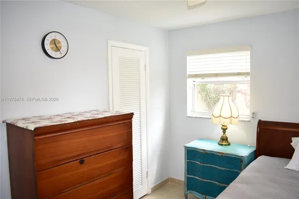 a room with a window and a lamp