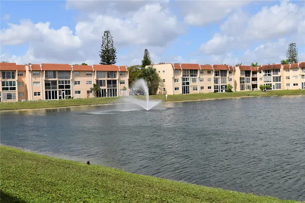 a front view of a house with a lake view