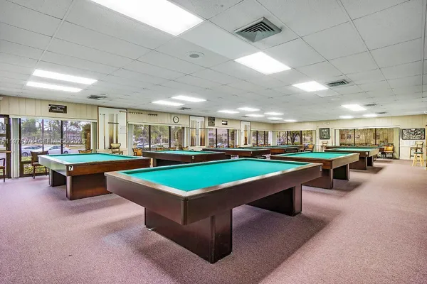 a view of a swimming pool with seating space