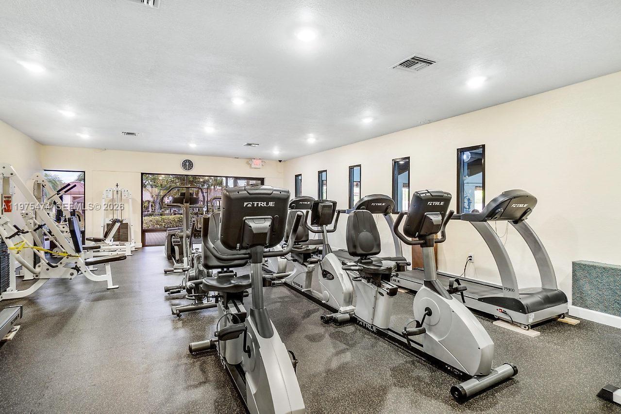 2801 North Pine Island Road, Unit 112 Sunrise, FL 33322 - Photo 49 of 49 a view of a room with gym equipment