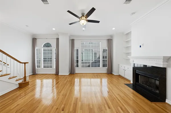 a view of livingroom with hardwood floor and a ceiling fan