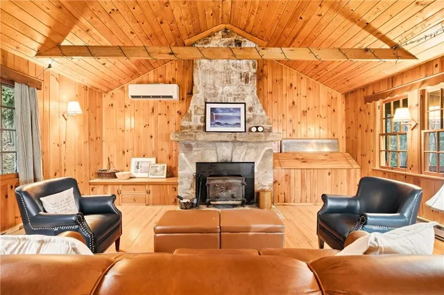 a living room with furniture and a book shelf