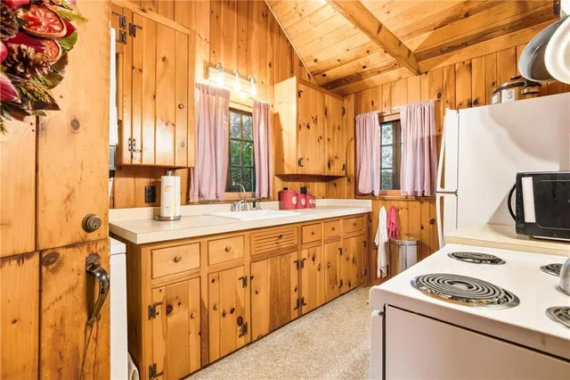 a view of a kitchen cabinets and a sink