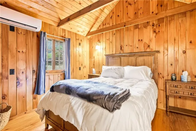 a bedroom with a bed and curtain